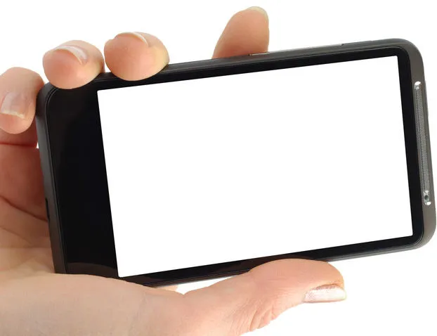 Hand holding a smartphone with a brightly lit blank screen