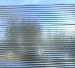 Close-up of a Panaglo™ panel: translucent, horizontally ribbed material with a textured, etched-glass look