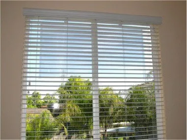 Residential window with the film installed, working together with the existing window blinds